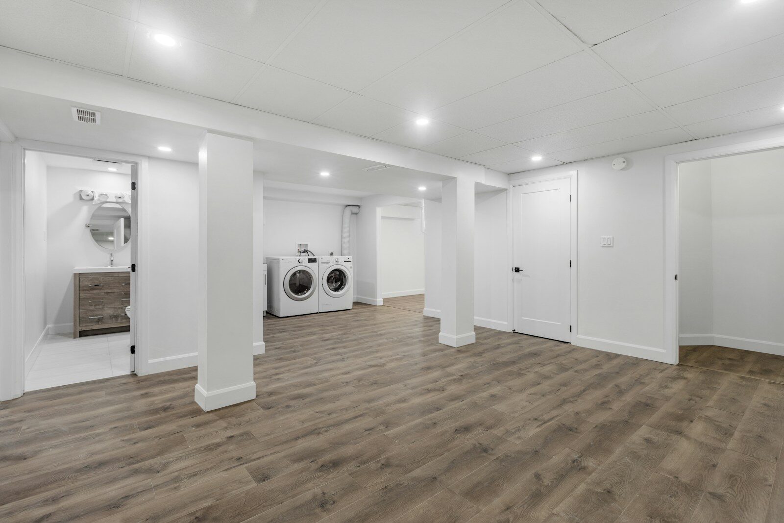 Basement Finishing an empty room with a washer and dryer