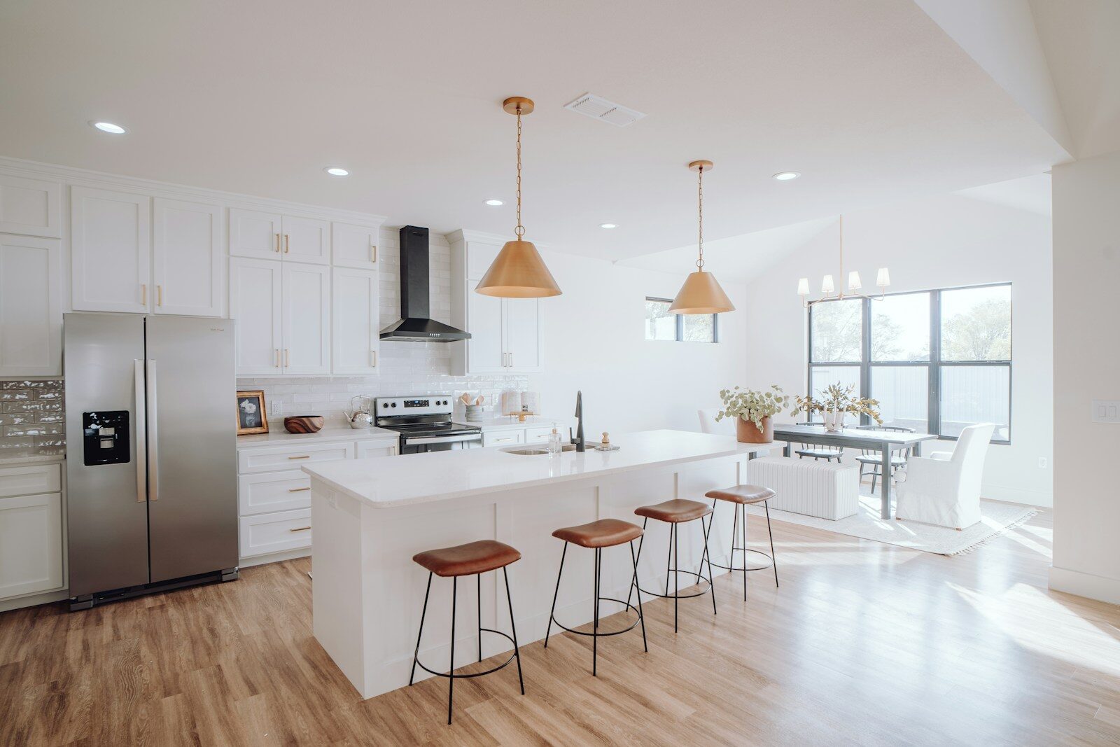 Photo by Bailey Alexander a kitchen with a center island with stools
